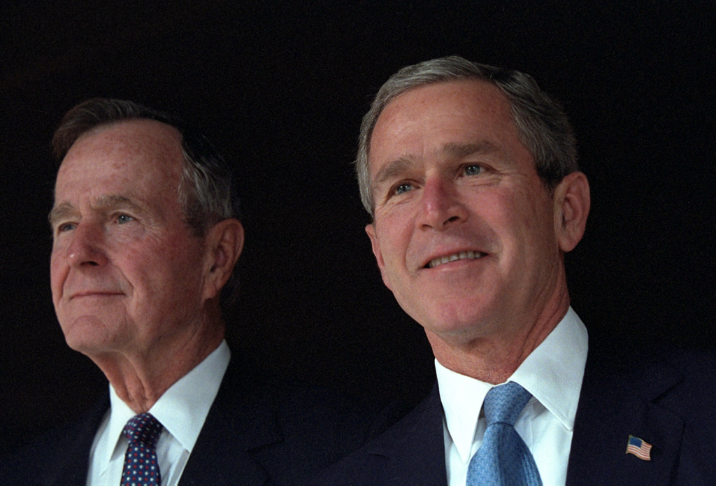 President George W. Bush poses with his father, former President George H. W. Bush,  December 23, 2001, at Camp David in Thurmont, Maryland. (P11417-21)