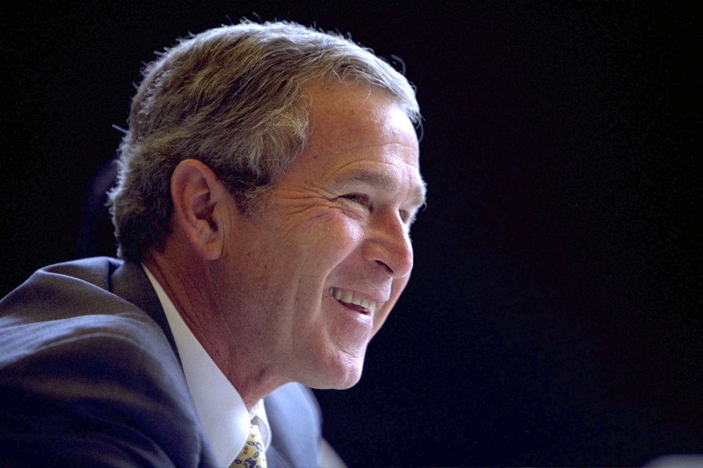 President George W. Bush smiles as he participates in a Roundtable with Service Providers, July 1, 2002, in Cleveland, Ohio. (P19237-19A)
