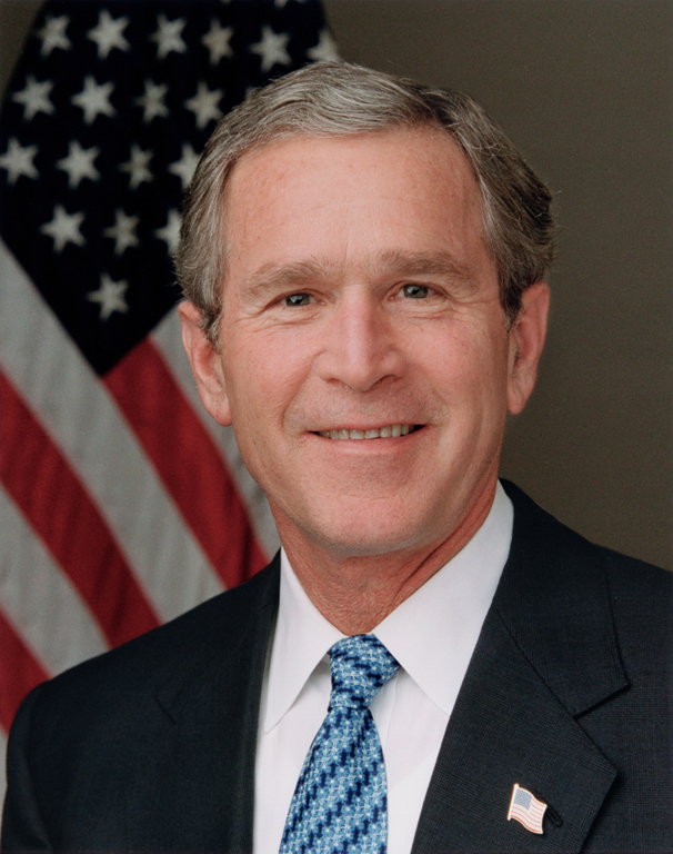 President George W. Bush poses for his official portrait in the Roosevelt Room of the White House, January 14, 2004.  (P25695-23)