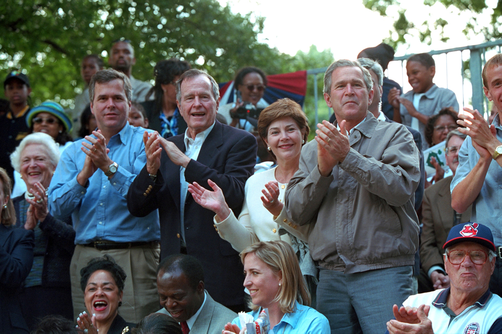 Mrs. Barbara Bush, Florida Governor Jeb Bush, former President George H. W. Bush, Mrs. Laura Bush and President George W. Bush lead the applause for players during Tee Ball game.