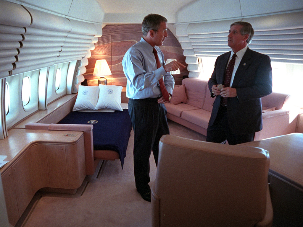 President George W. Bush confers with White House Chief of Staff Andrew Card, September 11, 2001, in the President's bedroom aboard Air Force One. (P7067-32)
