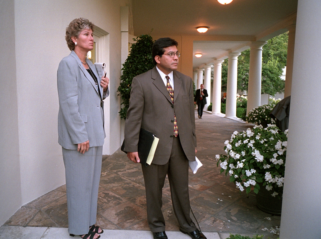 Counselor Karen Hughes and Counsel Alberto Gonzales wait on the Colonnade for President George W. Bush to arrive at the White House, September 11, 2001. (P7111-04a)