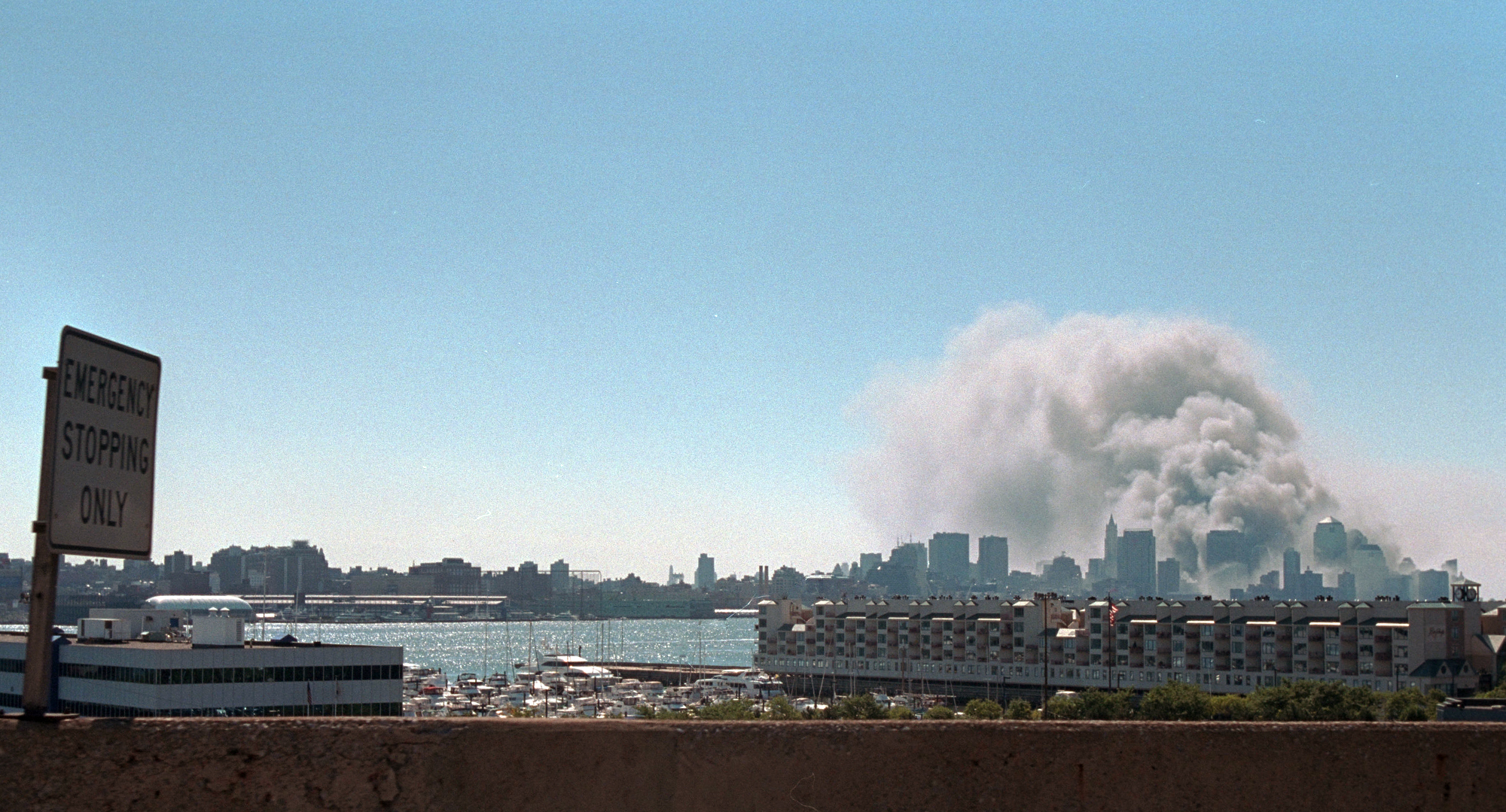 Smoke rises from the site of the World Trade Center, September 11, 2001. (P7127-23)