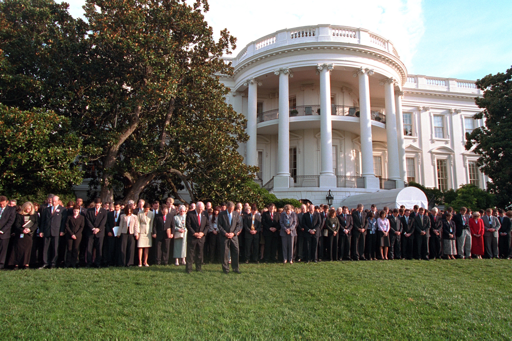 President George W. Bush and Vice President Dick Cheney are joined by White House staff members, September 18, 2001, as they observe a moment of silence on the White House South Lawn. (P7492-06)