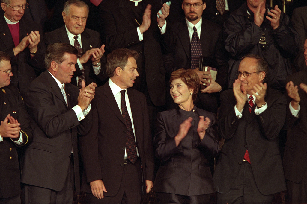 British Prime Minister Tony Blair receives applause as he stands with Mrs. Laura Bush during a televised national address to the joint session of Congress, September 20, 2001. (P7632-15)
