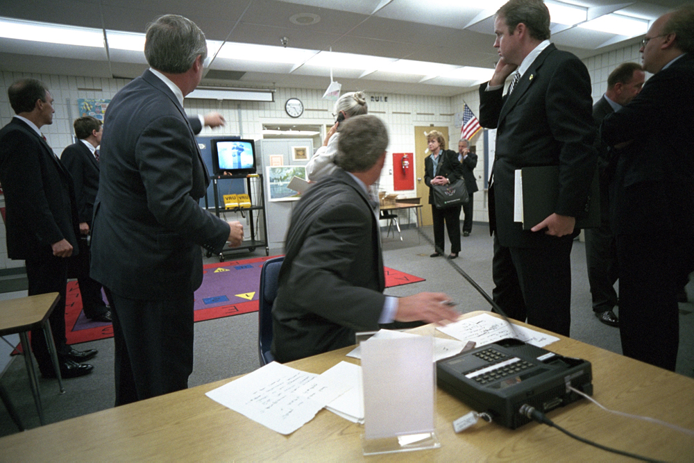 President George W. Bush watches news footage from Emma E. Booker Elementary School in Sarasota, Florida, of Flight 175 hitting the South Tower of the World Trade Center, September 11, 2001.
