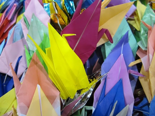 In Japan there is a tradition of folding one thousand origami paper cranes and stringing them together to have a wish granted by a crane. The students of Tamagawa School assembled three thousand cranes! 
