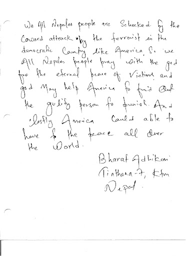 A citizen of the Federal Democratic Republic of Nepal offers Americans a message of encouragement in a condolence book.