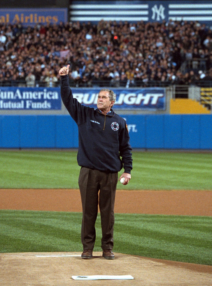 President George W. Bush gives a thumbs-up as he stands on the mound at Yankee Stadium.