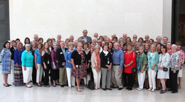 Docents gather for a posed photograph
