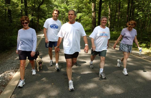 President George W. Bush, First Lady Laura Bush, Marvin Bush, Andy Card and Kathleene Card Walk at Camp David on June 29, 2002. 