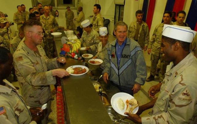 President George W. Bush Meets with Troops and Serves Thanksgiving Dinner at the Bob Hope Dining Facility, Baghdad International Airport, Iraq