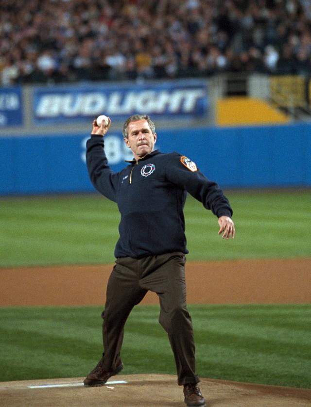 President George W. Bush throws out the ceremonial first pitch at Yankee Stadium before Game Three of the World Series between the Arizona Diamondbacks and the New York Yankees.