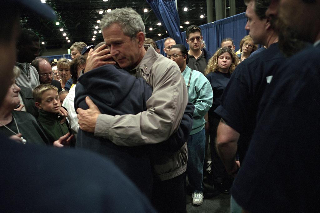 President George W. Bush hugs families of victims of the World Trade Center disaster.