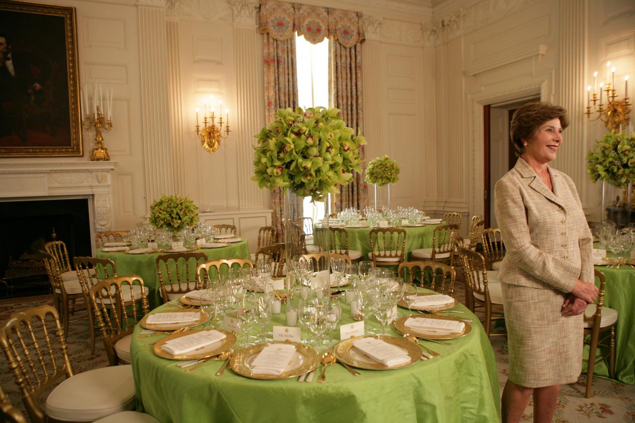 Mrs. Laura Bush with table settings for dinner for Prime Minister Junichiro Koizumi of Japan, June 29, 2006.