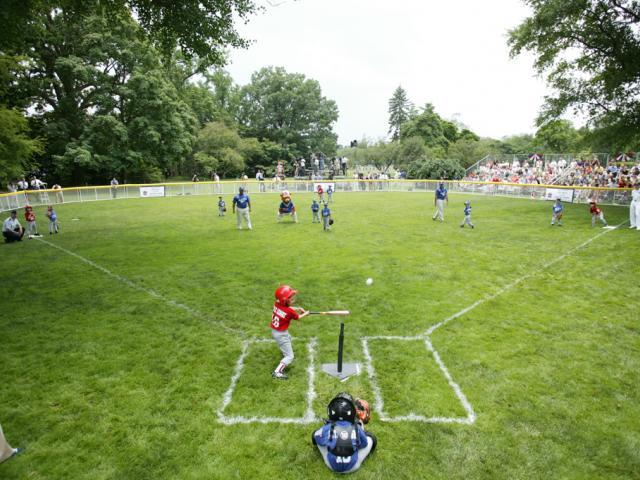 A McGuire Air Force Base Yankee leads off with a hit during Tee Ball against the Dolcom Little League Indians at the White House.