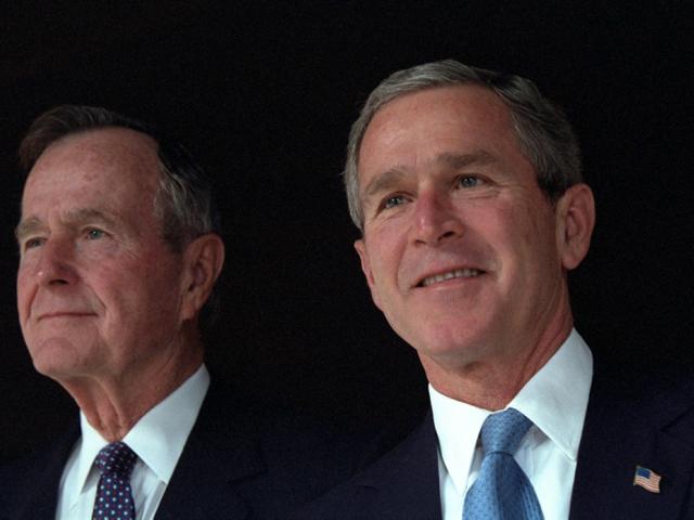 President George W. Bush poses with his father, former President George H. W. Bush,  December 23, 2001, at Camp David in Thurmont, Maryland. (P11417-21)