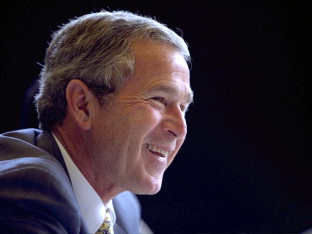 President George W. Bush smiles as he participates in a Roundtable with Service Providers, July 1, 2002, in Cleveland, Ohio. (P19237-19A)