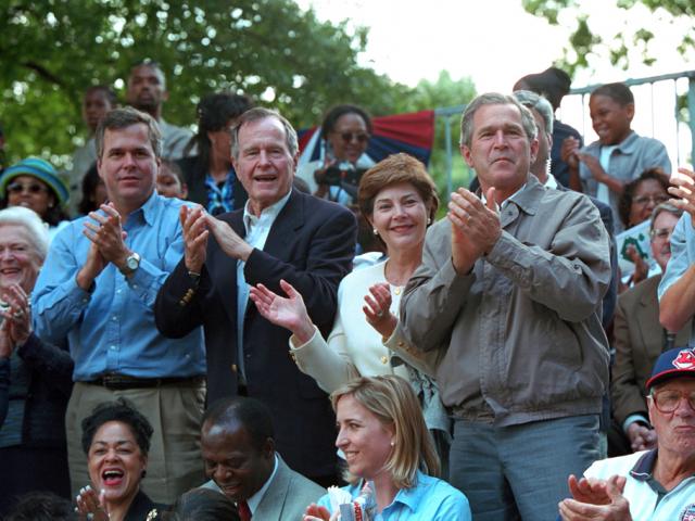 Mrs. Barbara Bush, Florida Governor Jeb Bush, former President George H. W. Bush, Mrs. Laura Bush and President George W. Bush lead the applause for players during Tee Ball game.