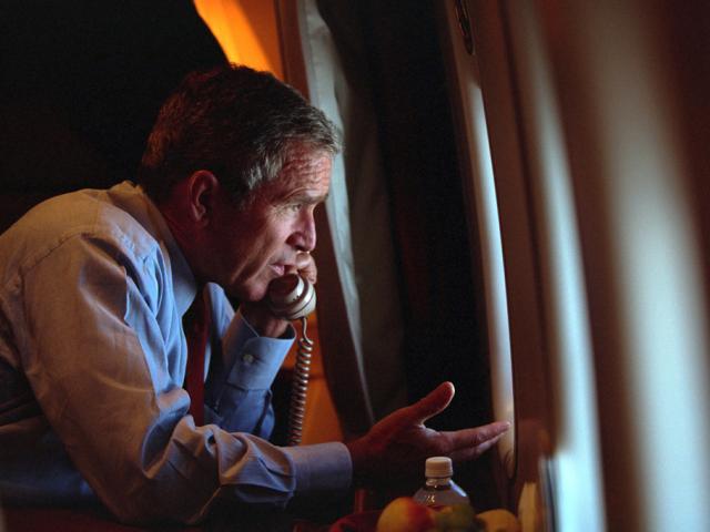 After departing Offutt Air Force Base in Nebraska, President George W. Bush confers with Vice President Dick Cheney from Air Force One, September 11, 2001, during the flight to Andrews Air Force Base. (P7091-18)