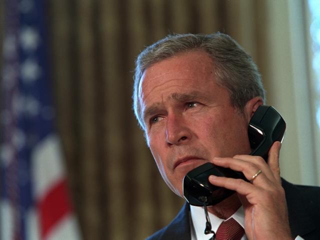 Pledging support for New York, President George Bush talks with Governor George Pataki and New York City Mayor Rudolph Giuliani, September 13, 2001, in a televised telephone conversation from the Oval Office. (P7267-24)