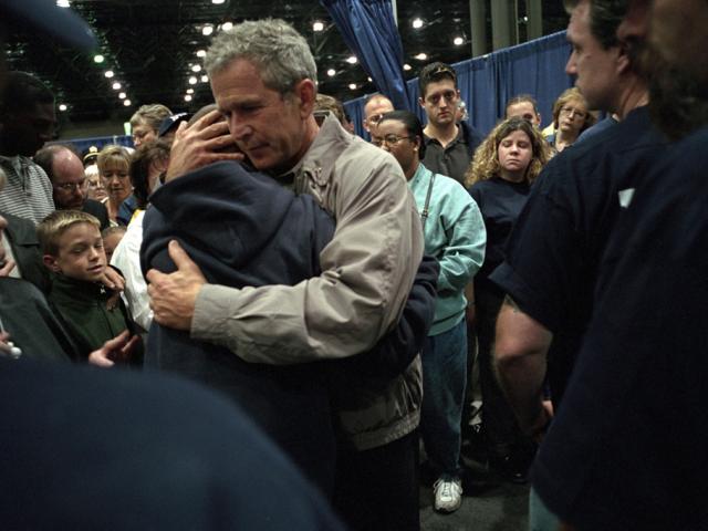 President George W. Bush hugs families of victims of the World Trade Center disaster.