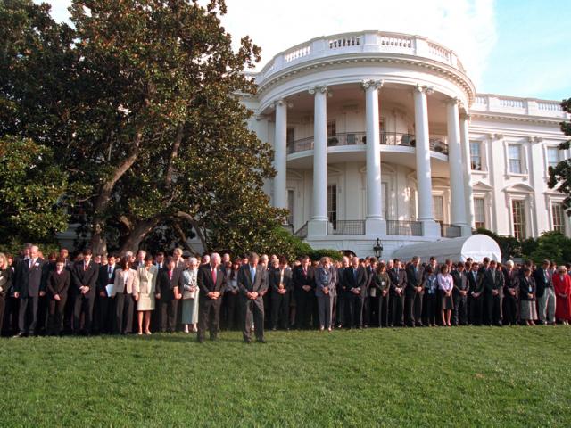 President George W. Bush and Vice President Dick Cheney are joined by White House staff members, September 18, 2001, as they observe a moment of silence on the White House South Lawn. (P7492-06)