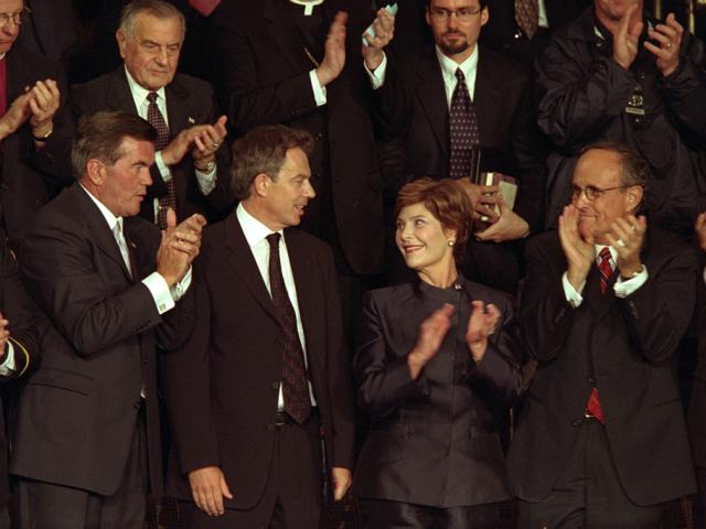 British Prime Minister Tony Blair receives applause as he stands with Mrs. Laura Bush during a televised national address to the joint session of Congress, September 20, 2001. (P7632-15)