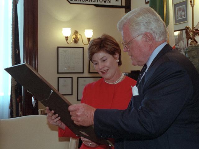 Senator Ted Kennedy shows Mrs. Laura Bush art and memorabilia in his office at the Russell Senate Office Building, September 11, 2001.