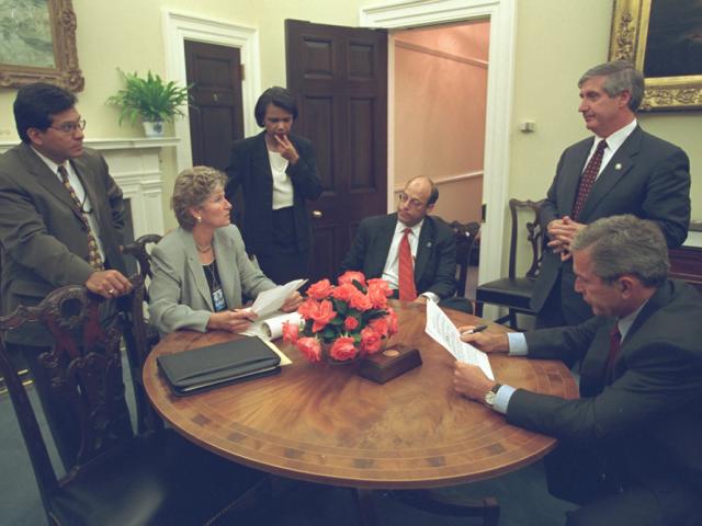 Working with His Senior Staff, President George W. Bush Reviews a Speech Regarding the Day's Terrorist Attacks that He Will Deliver to the Nation from the Oval Office, September 11, 2001.