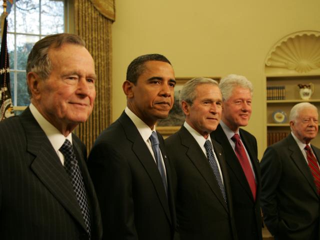 President George W. Bush stood with President-elect Barack Obama and former Presidents George H.W. Bush, Bill Clinton, and Jimmy Carter during their January 7, 2009 visit to the Oval Office of the White House.