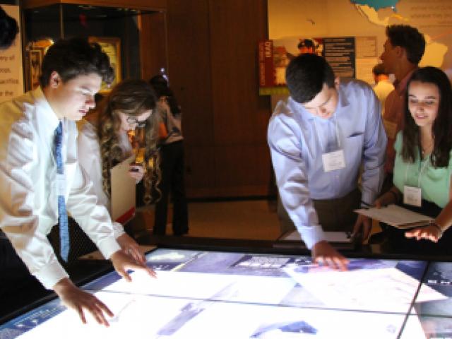 People looking at a light table