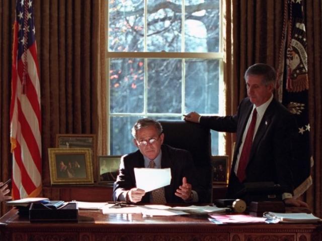 President George W. Bush meets with Andy Card, Karl Rove, and Karen Hughes in the Oval Office of the White House on December 20, 2001.