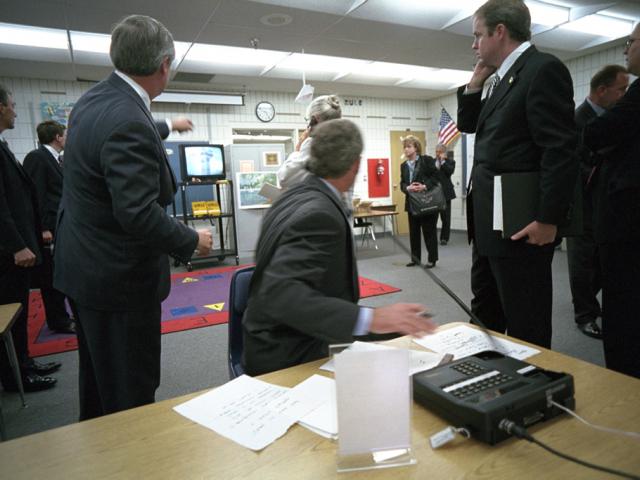 President George W. Bush watches news footage from Emma E. Booker Elementary School in Sarasota, Florida, of Flight 175 hitting the South Tower of the World Trade Center, September 11, 2001.