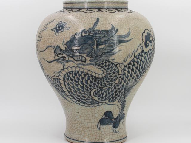 Speckled-brown vase decorated in blue with a continuous five clawed dragon and scattered flaming pearl devices. The form features a straight wide neck with a collared rim, made by Park, Kung Sun; signed on bottom. Gifted by Roh Moo-hyun, President of the Republic of Korea.