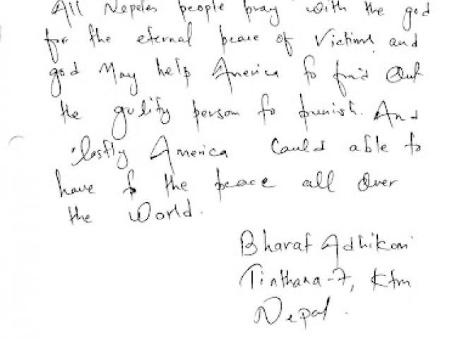 A citizen of the Federal Democratic Republic of Nepal offers Americans a message of encouragement in a condolence book.