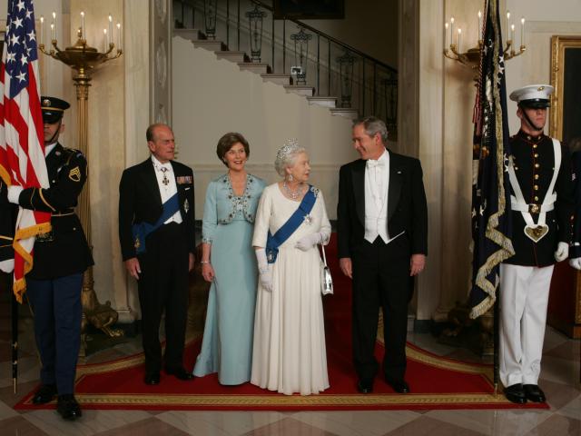 President George W. Bush and Mrs. Laura Bush Escort Her Majesty Queen Elizabeth II and His Royal Highness The Prince Philip, Duke of Edinburgh, from the Grand Staircase.