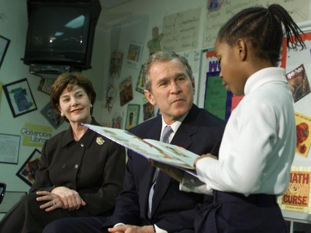 President George W. Bush and Mrs. Laura Bush Listen as Student Janea Bufford Reads Aloud at Moline Elementary School in St. Louis, Missouri