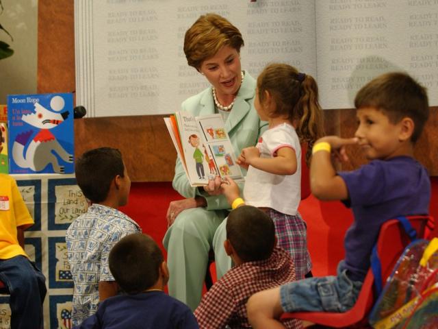 Mrs. Laura Bush reads a picture book to children