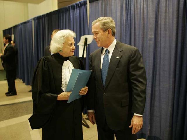 President George W. Bush and Supreme Court Justice Sandra Day O’Connor Talk Backstage at the Swearing-In Ceremony for the Secretary of Homeland Security, March 3, 2005.