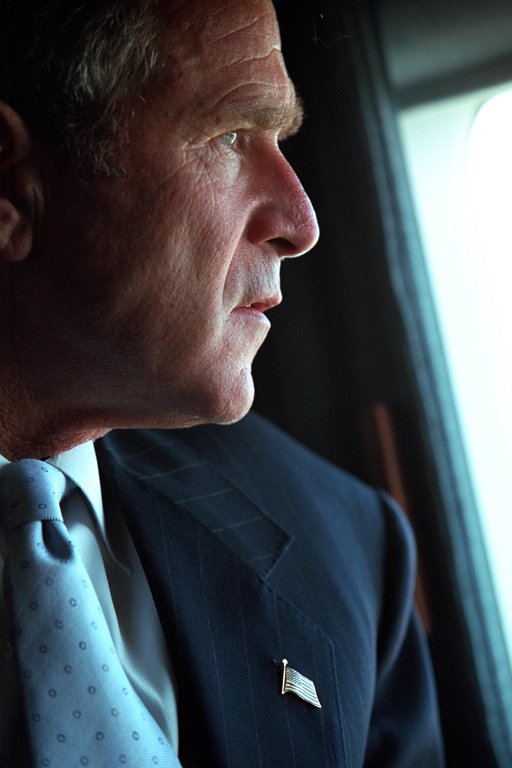 President George W. Bush surveys the damage to the Pentagon from the presidential helicopter, Marine One, September 14, 2001, as he travels to New York City. (P7356-13)