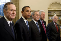 President George W. Bush stands with President-elect Barack Obama and former Presidents George H. W. Bush, Bill Clinton, and Jimmy Carter during their visit, January 7, 2009, in the Oval Office of the White House. (P010709JB-0343)