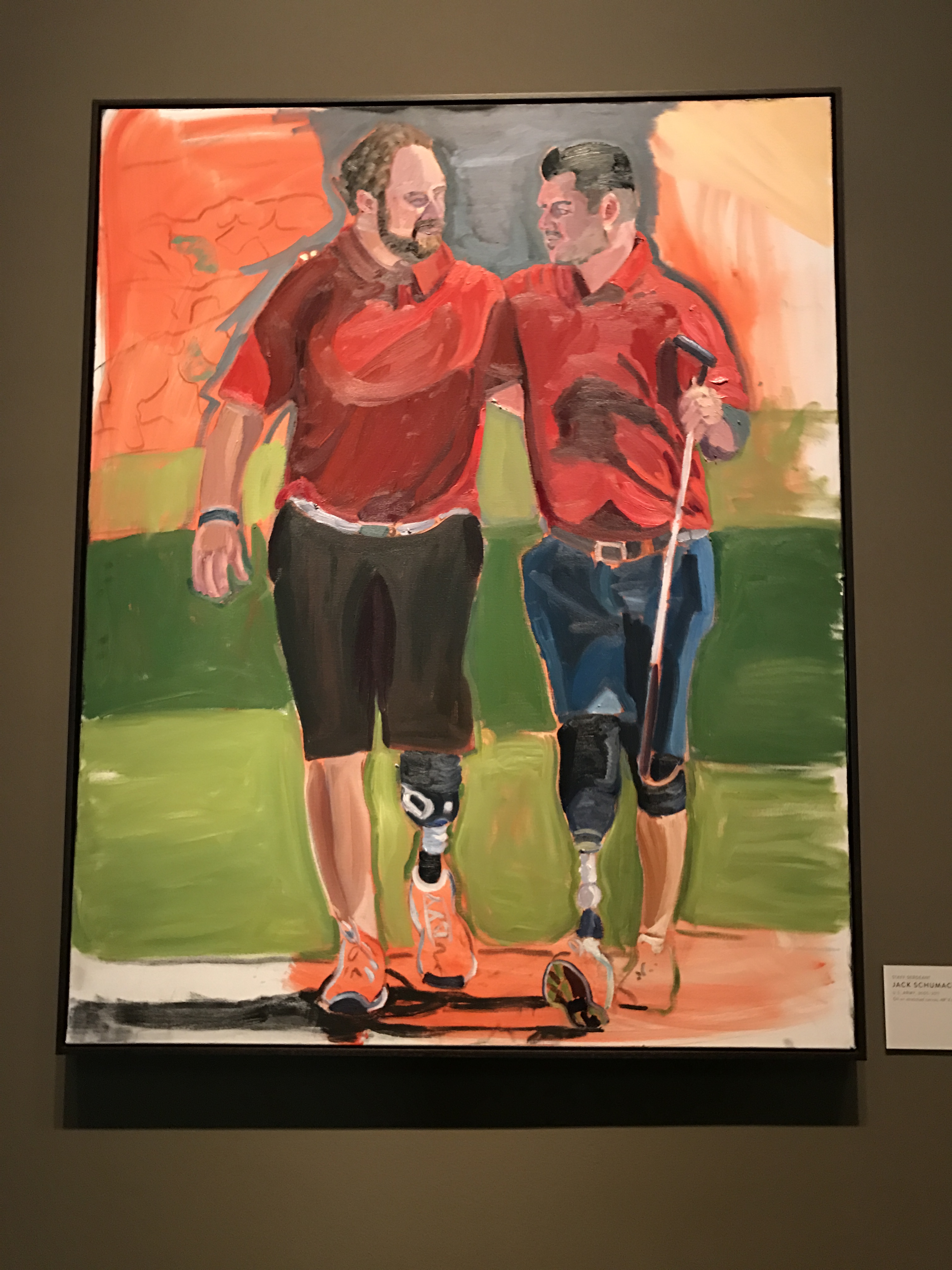 A photo of a portrait of Jack Schumacher and a companion by President George W Bush, part of the  2017 exhibit Portraits of Courage, at the George W Bush Library and Museum