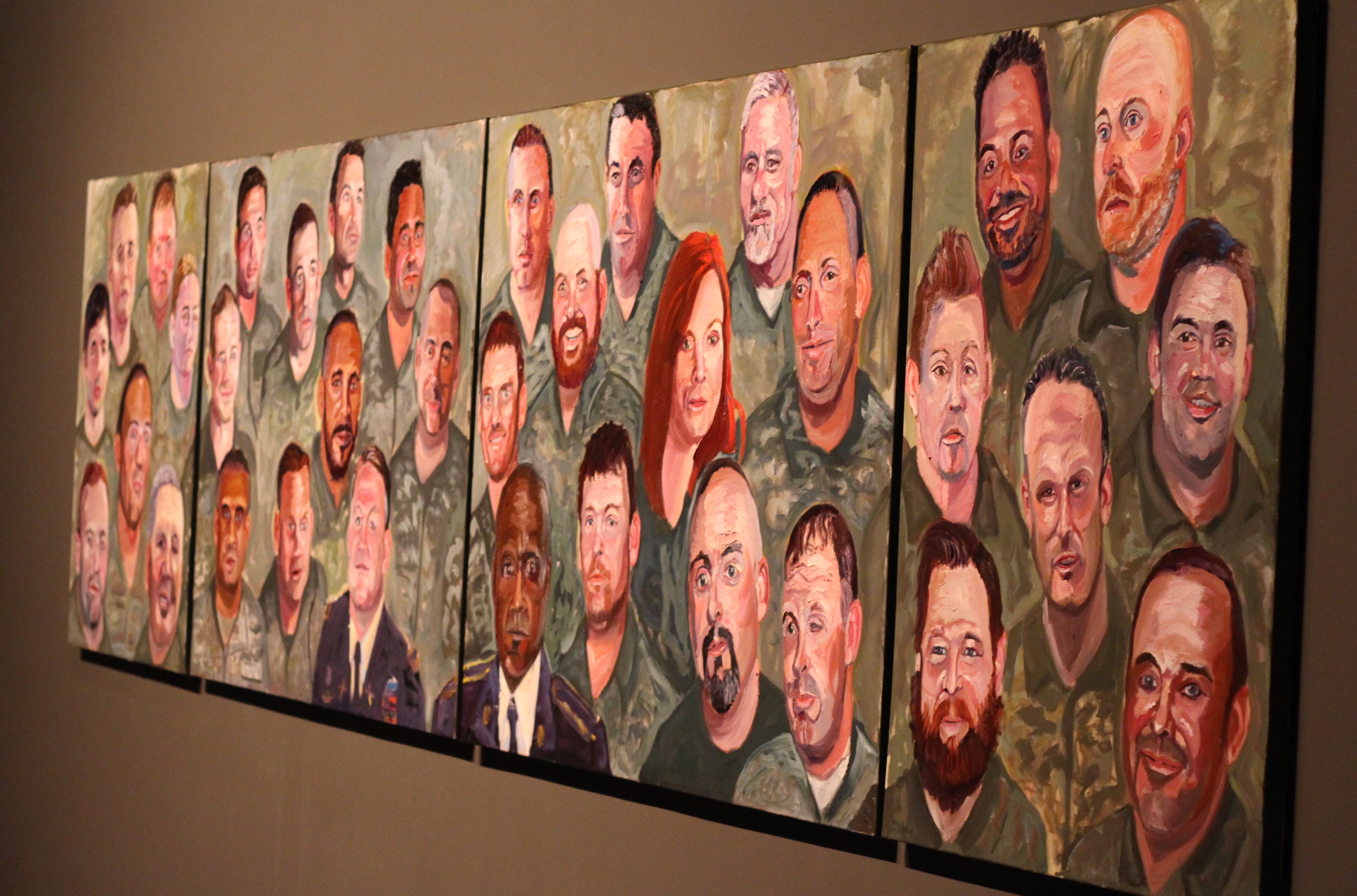 A photo of a multi-panel painting by President George W Bush, part of the 2017 exhibit Portraits of Courage, at the George W Bush Library and Museum