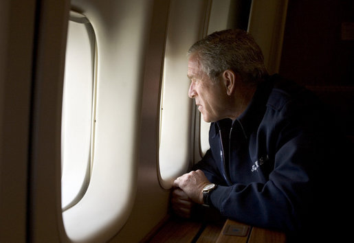 President George W. Bush looks out over the devastation in New Orleans from Hurricane Katrina as he heads back to Washington D.C. Wednesday, Aug. 31, 2005, aboard Air Force One.