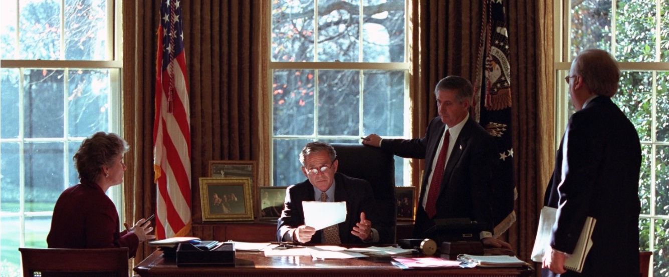 President George W. Bush meets with Andy Card, Karl Rove, and Karen Hughes in the Oval Office of the White House on December 20, 2001.