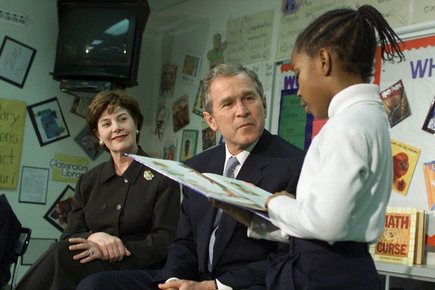 President George W. Bush and Mrs. Laura Bush Listen as Student Janea Bufford Reads Aloud at Moline Elementary School in St. Louis, Missouri