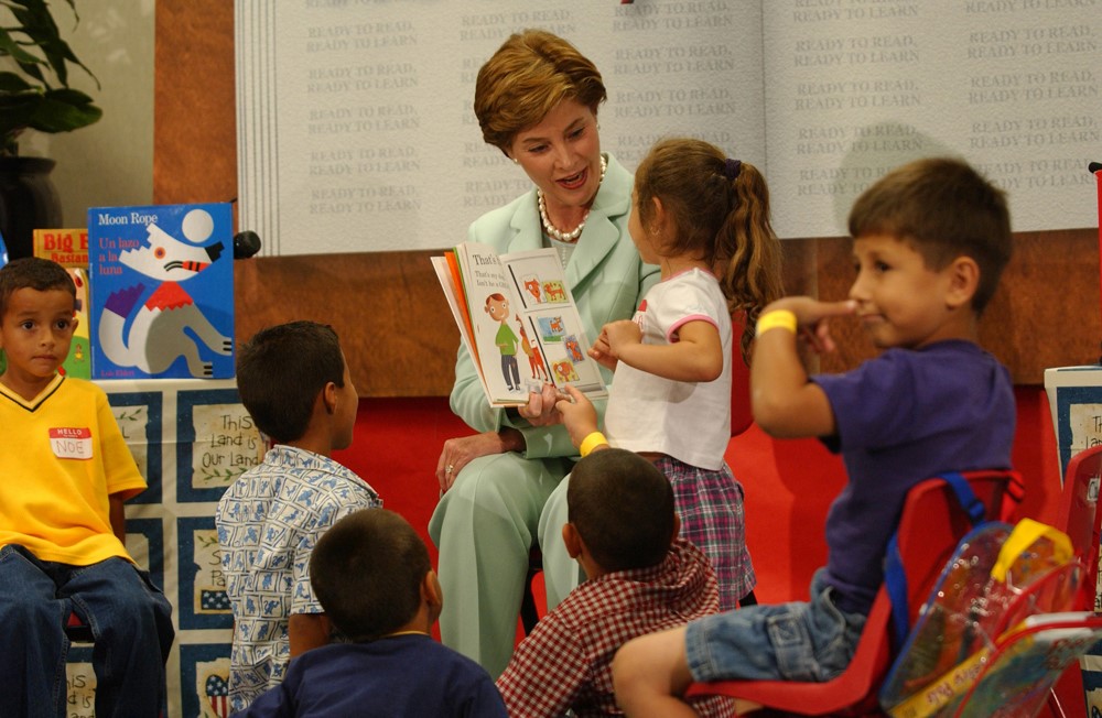 Mrs. Laura Bush reads a picture book to children
