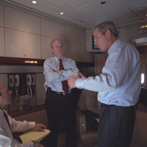  President George W. Bush speaks with Ari Fleischer, left, and Karl Rove aboard Air Force One.