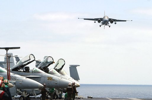President George W. Bush approached the flight deck of the USS Abraham Lincoln in a S-3B Viking jet, May 1, 2003.